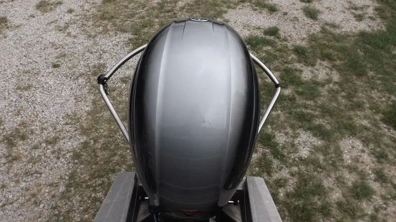 Slide: The Image of Top view of 2021 Veranda Fish VF22F2 boat motor on gravel and grass. - 7