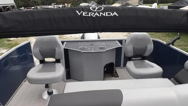 Slide: The Image of 2021 Veranda Fish VF22F2 pontoon boat interior with seating and control console. - 8