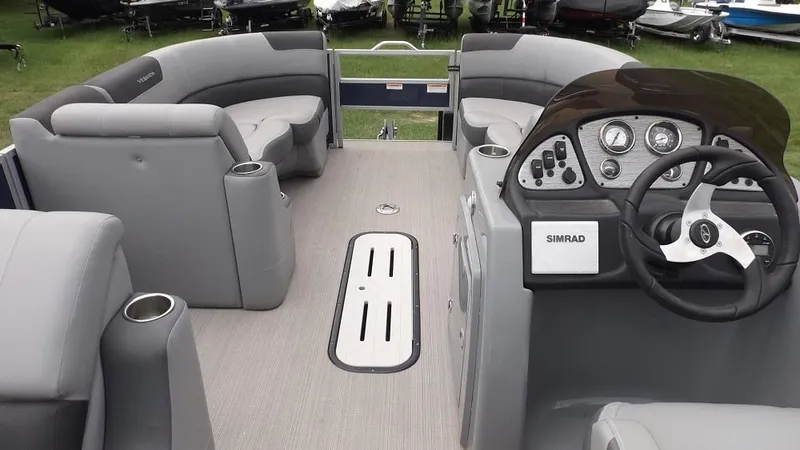 Slide: The Image of 2021 Veranda Fish VF22F2 pontoon boat interior with gray seating and steering console. - 9
