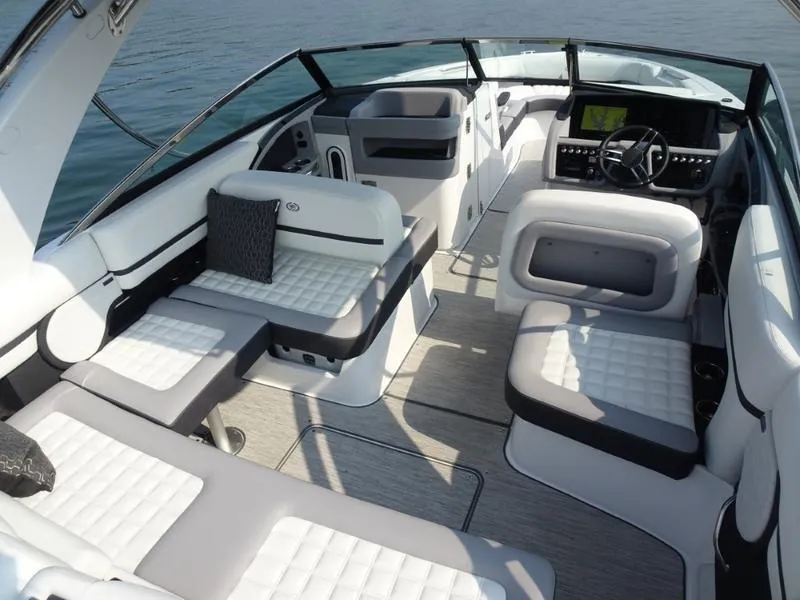 Slide: The Image of 2025 Cobalt R30 boat interior with luxurious seating and modern dashboard. - 14