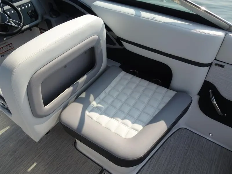 Slide: The Image of 2025 Cobalt R30 boat interior with white and gray cushioned seating. - 15