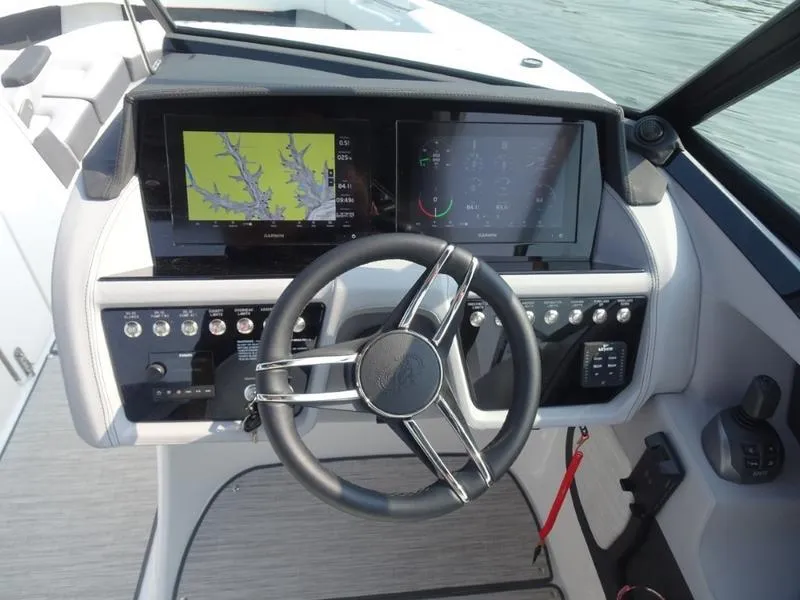Slide: The Image of Cobalt R30 2025 boat dashboard with steering wheel and navigation screens. - 19