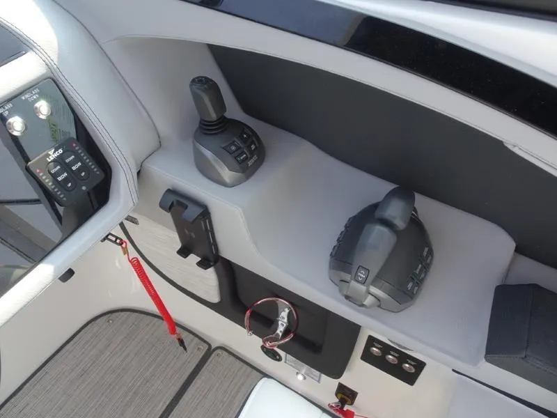 Slide: The Image of Control panel of 2025 Cobalt R30 boat with joystick and throttle. - 20