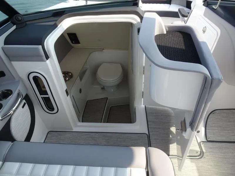 Slide: The Image of 2025 Cobalt R30 boat interior with a compact bathroom and modern amenities. - 22