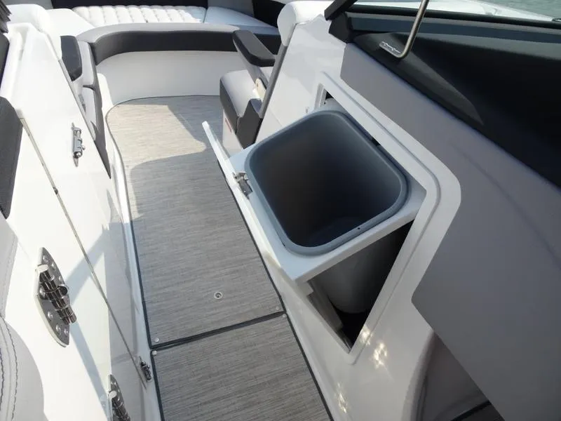 Slide: The Image of 2025 Cobalt R30 boat interior with open storage compartment. - 25
