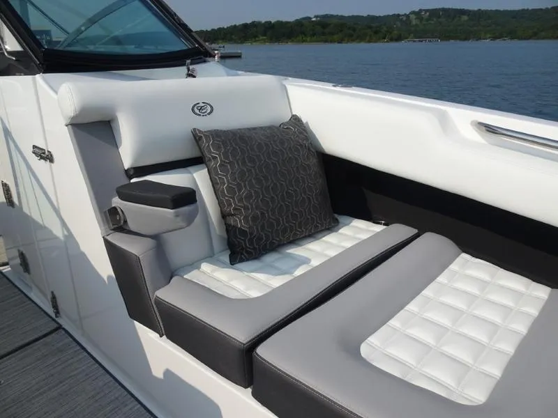 Slide: The Image of 2025 Cobalt R30 boat interior with cushioned seating and decorative pillow. - 28