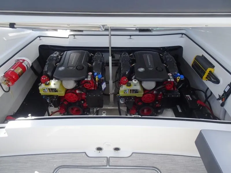 Slide: The Image of Engine compartment of a 2025 Cobalt R30 boat with twin engines and fire extinguisher. - 30