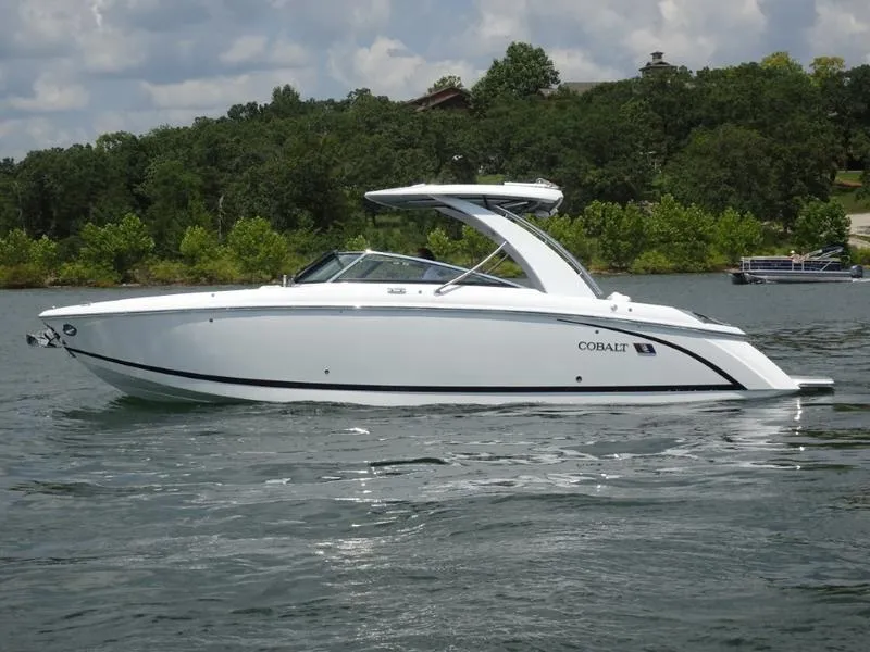Slide: The Image of 2025 Cobalt R30 boat on a lake with a forested background. - 8