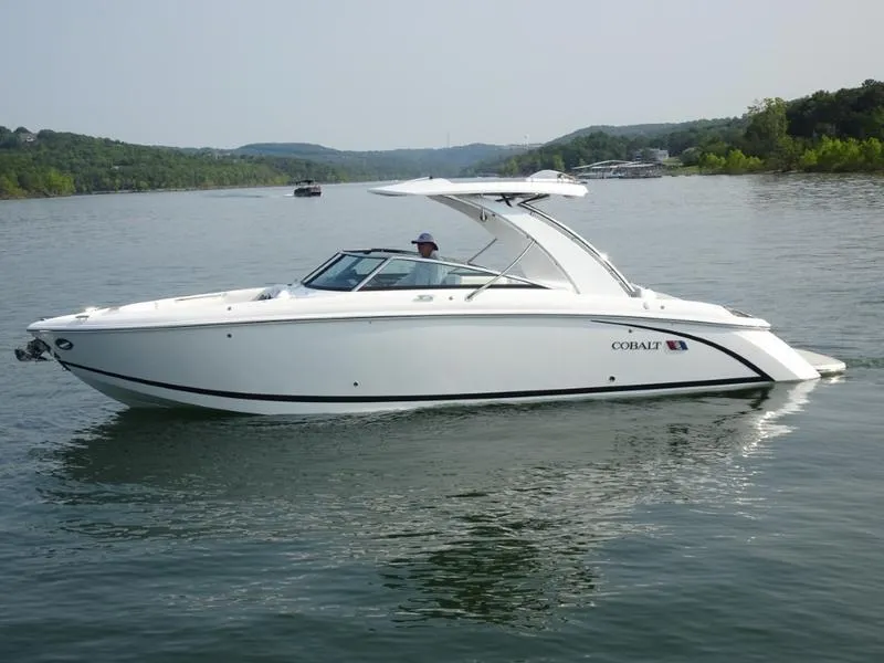 Slide: The Image of 2025 Cobalt R30 boat cruising on a lake. - 9
