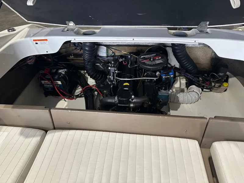 Slide: The Image of 2004 Glastron SX175 boat engine compartment with battery and wiring. - 10