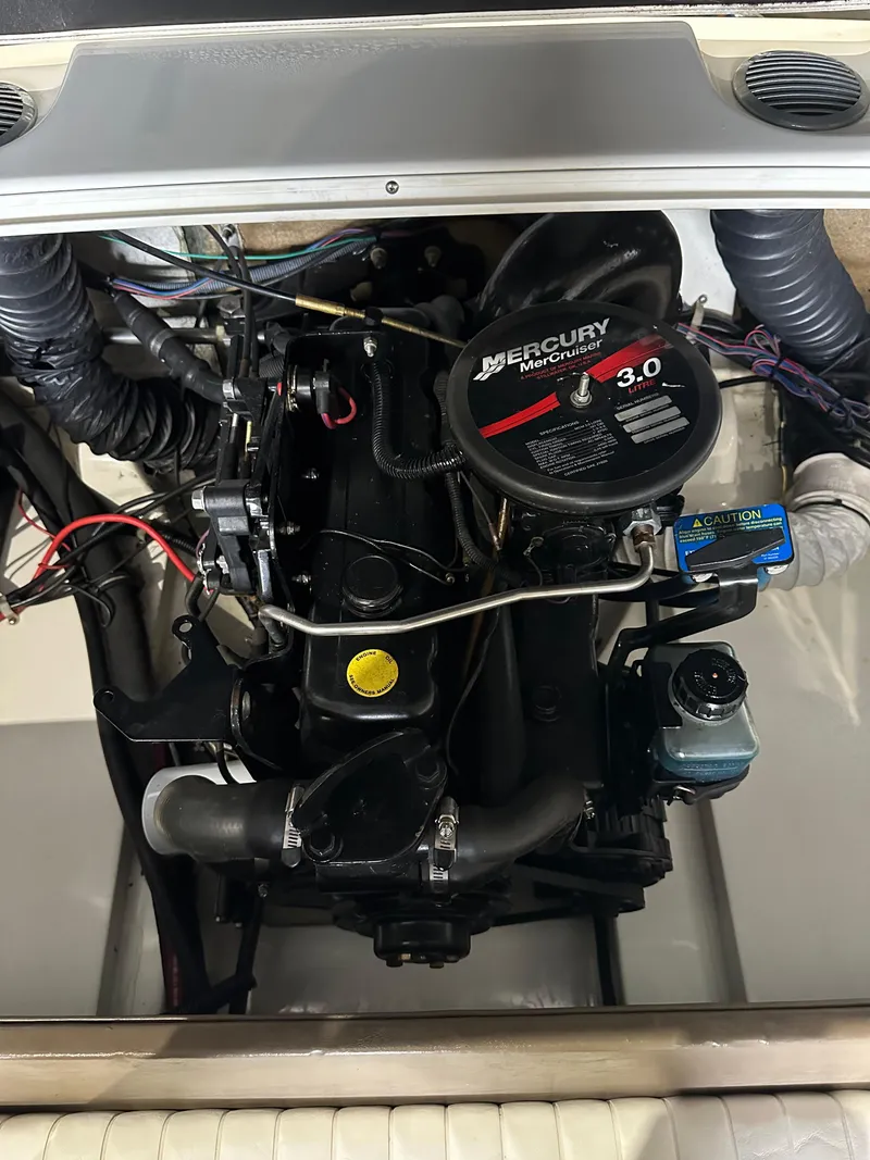 Slide: The Image of 2004 Glastron SX175 boat engine compartment with Mercury 3.0 motor. - 11