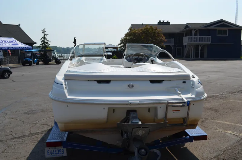 Slide: The Image of 2004 Glastron SX175 boat on trailer in marina parking lot. - 3