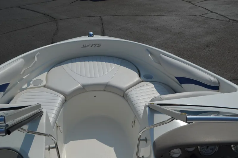 Slide: The Image of 2004 Glastron SX175 boat interior with white seating. - 6