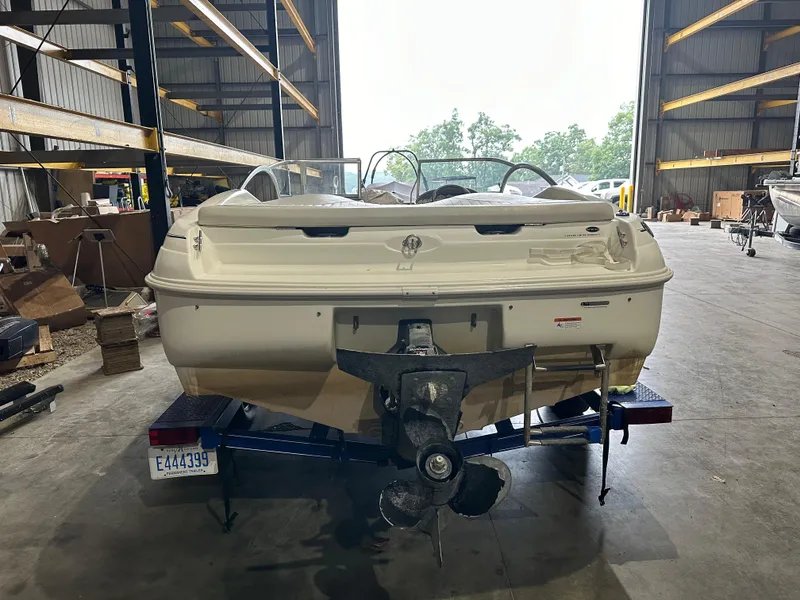 Slide: The Image of 2004 Glastron SX175 boat in storage facility, rear view. - 8