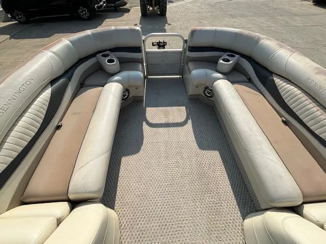 Slide: The Image of 2007 Bennington 2275RL pontoon boat interior with spacious seating and cup holders. - 10