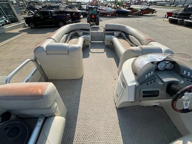 Slide: The Image of 2007 Bennington 2275RL pontoon boat interior with seating and control console. - 12