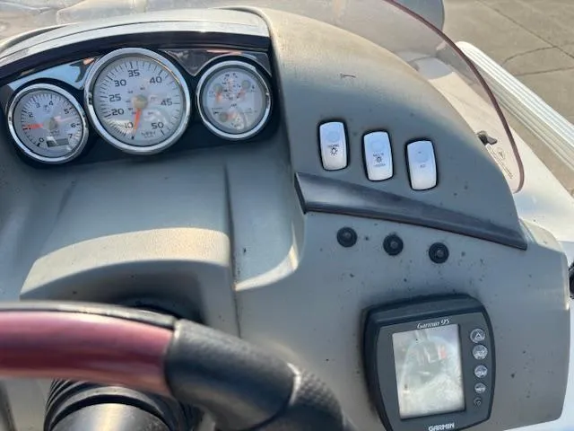 Slide: The Image of Dashboard of a 2007 Bennington 2275RL boat with gauges and Garmin GPS. - 14