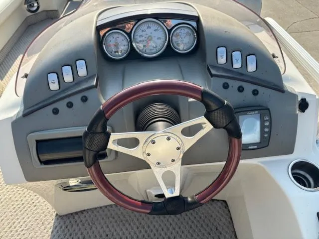Slide: The Image of 2007 Bennington 2275RL boat dashboard with steering wheel and gauges. - 15