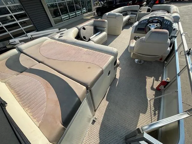 Slide: The Image of 2007 Bennington 2275RL pontoon boat interior with seating and helm. - 20