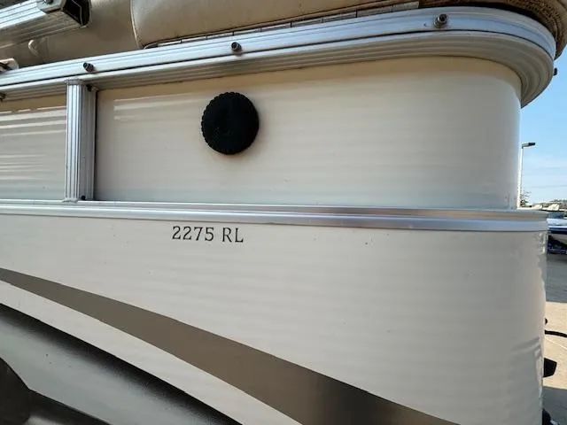 Slide: The Image of 2007 Bennington 2275RL pontoon boat side view with model number. - 25