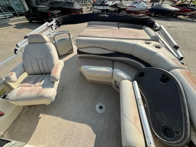 Slide: The Image of 2007 Bennington 2275RL pontoon boat interior with seating and helm. - 5