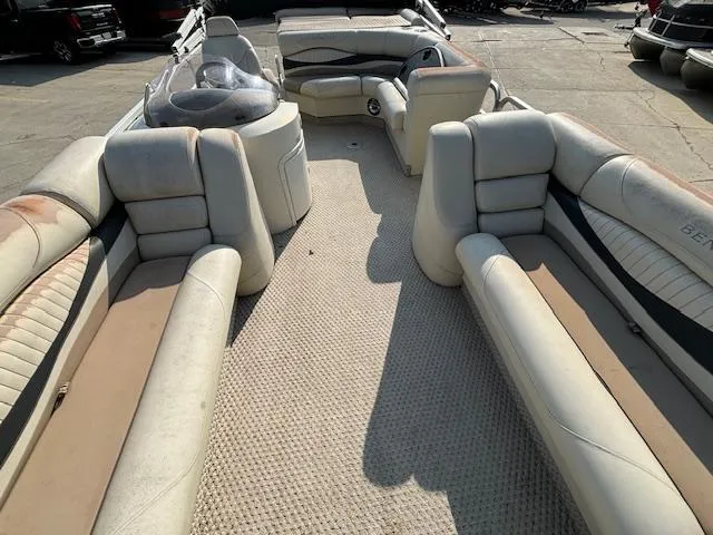 Slide: The Image of 2007 Bennington 2275RL pontoon boat interior with spacious seating and carpeted floor. - 8