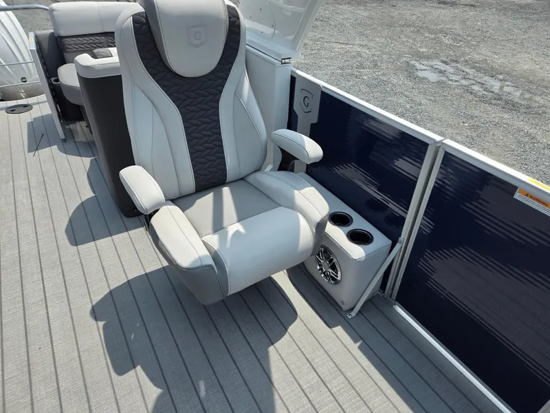 Slide: The Image of 2025 Godfrey Monaco 235 SB boat interior with luxury captain's chair and cup holders. - 12