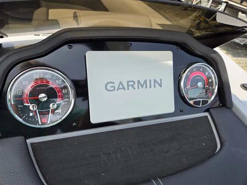 Slide: The Image of Dashboard of 2025 Godfrey Monaco 235 SB with Garmin display and gauges. - 15