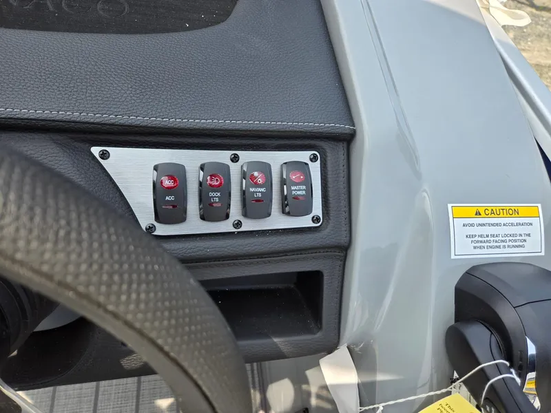 Slide: The Image of Control panel of a 2025 Godfrey Monaco 235 SB boat with labeled switches. - 17