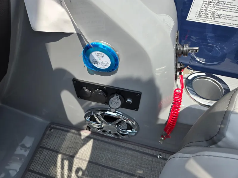 Slide: The Image of Control panel of 2025 Godfrey Monaco 235 SB boat with speaker and safety lanyard. - 18