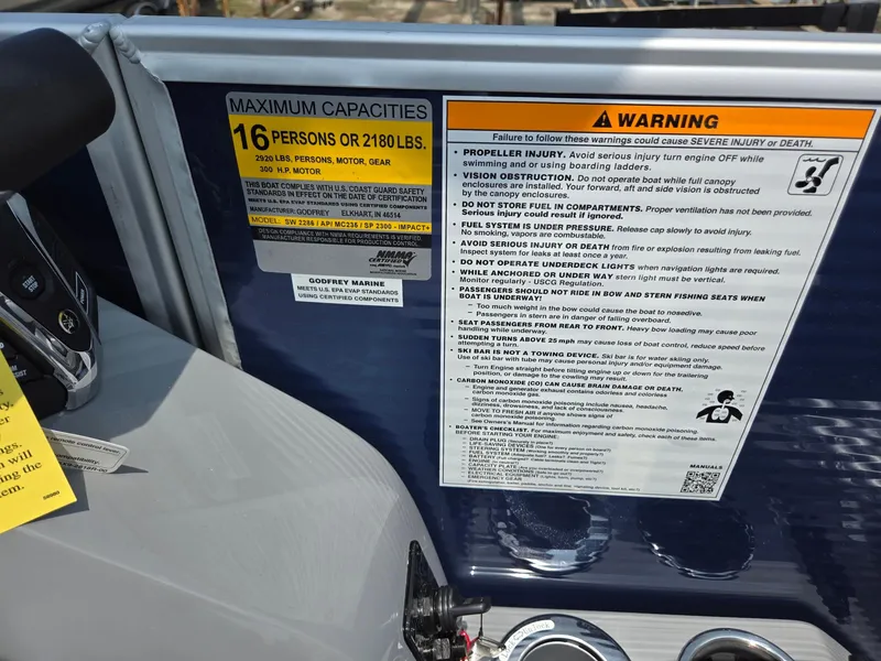 Slide: The Image of 2025 Godfrey Monaco 235 SB capacity and warning labels, 16 persons or 2180 lbs. - 19