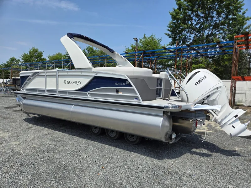 Slide: The Image of 2025 Godfrey Monaco 235 SB pontoon boat with Yamaha outboard motor. - 2