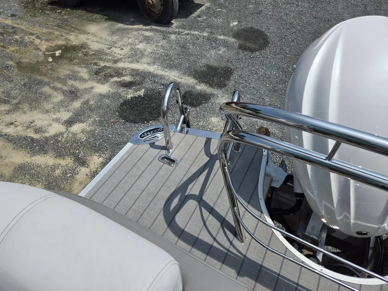 Slide: The Image of Godfrey Monaco 235 SB 2025 boat stern with outboard motor and railing. - 24