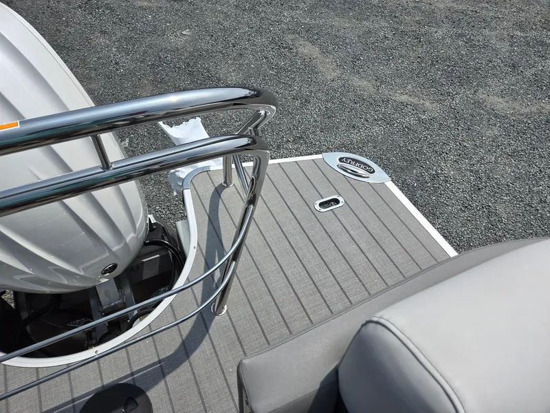 Slide: The Image of 2025 Godfrey Monaco 235 SB boat deck with motor and seating. - 25