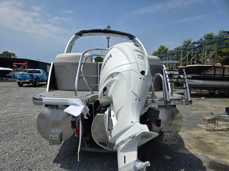 Slide: The Image of 2025 Godfrey Monaco 235 SB pontoon boat with Yamaha outboard motor. - 3