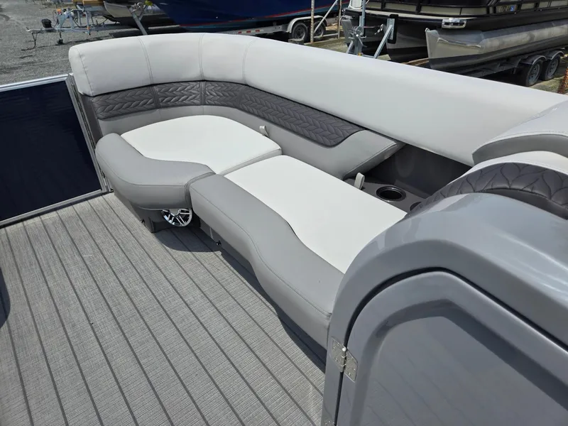 Slide: The Image of 2025 Godfrey Monaco 235 SB boat interior with gray and white seating. - 34
