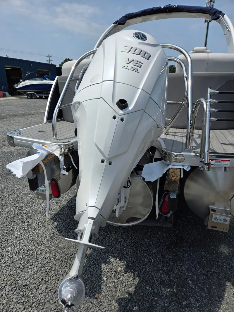 Slide: The Image of 2025 Godfrey Monaco 235 SB boat with a powerful 300 HP outboard motor. - 39