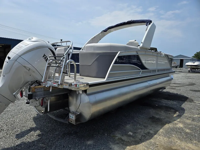 Slide: The Image of 2025 Godfrey Monaco 235 SB pontoon boat with Yamaha outboard motor. - 4