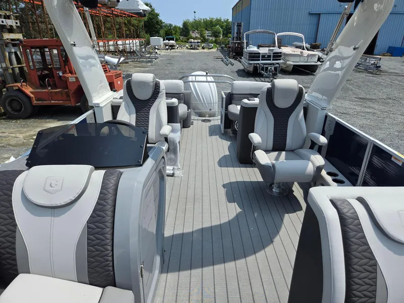 Slide: The Image of 2025 Godfrey Monaco 235 SB pontoon boat with luxurious seating and modern design. - 8