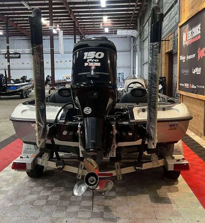 Slide: The Image of 2015 Ranger Z118C boat with 150 Pro XS engine in showroom. - 3