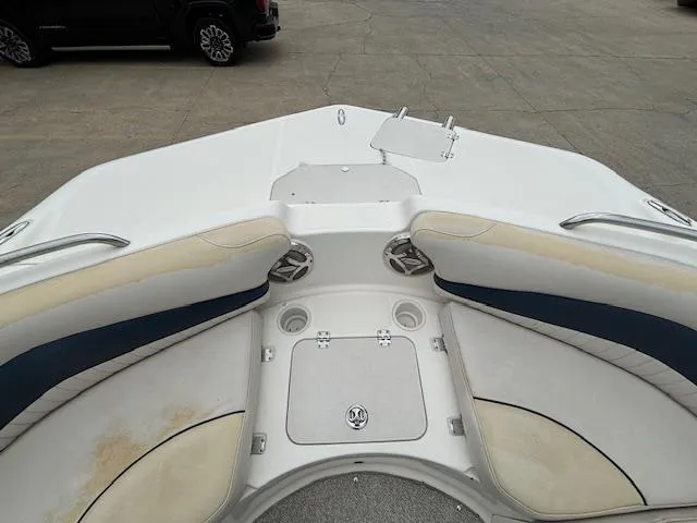 Slide: The Image of 2007 Hurricane 202FD boat bow seating area with storage compartments. - 16