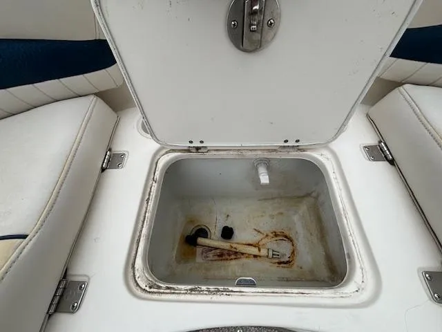 Slide: The Image of Open storage compartment on a 2007 Hurricane 202FD boat. - 17