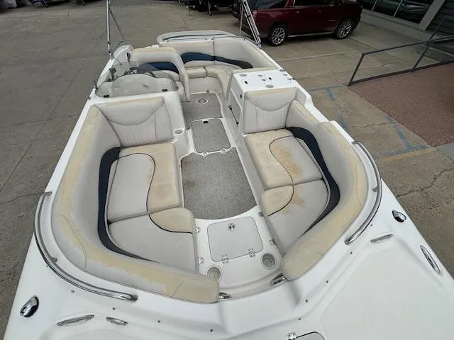 Slide: The Image of 2007 Hurricane 202FD boat with spacious seating and storage compartments. - 19