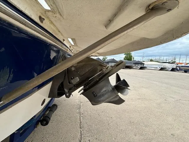 Slide: The Image of 2007 Hurricane 202FD boat propeller and stern view in a marina. - 2