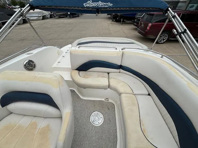 Slide: The Image of 2007 Hurricane 202FD boat interior with white and blue seating. - 22