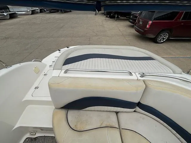 Slide: The Image of 2007 Hurricane 202FD boat interior with white and blue seating. - 23