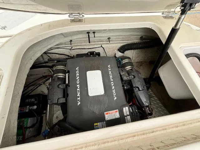 Slide: The Image of 2007 Hurricane 202FD boat engine compartment with Volvo Penta engine. - 24