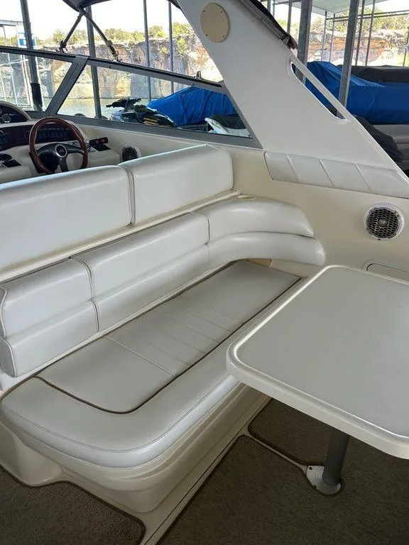Slide: The Image of 1997 Sea Ray 330 Sundancer interior seating and table area. - 14