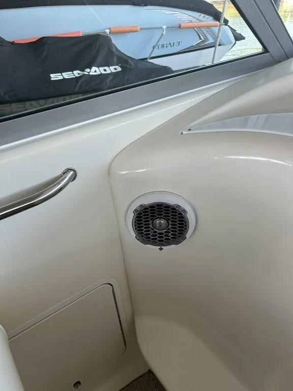 Slide: The Image of Interior of a 1997 Sea Ray 330 Sundancer boat showing a speaker and handrail. - 15