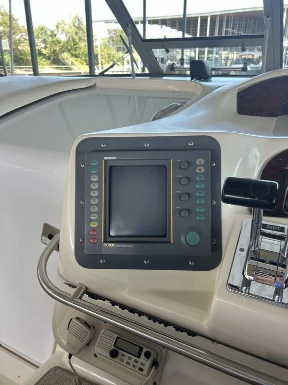 Slide: The Image of 1997 Sea Ray 330 Sundancer helm with navigation system. - 18